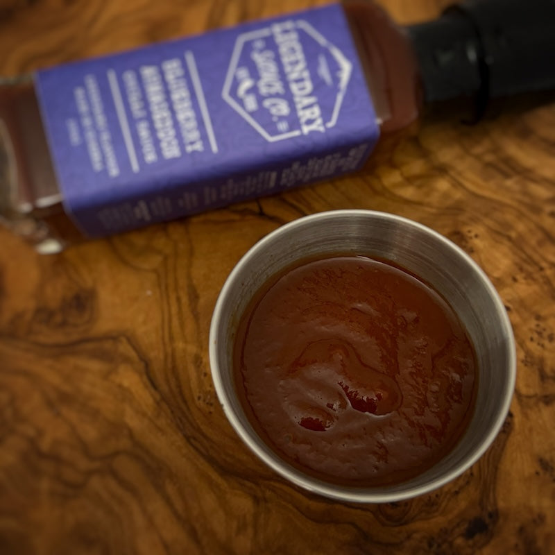 A small tub of hot sauce