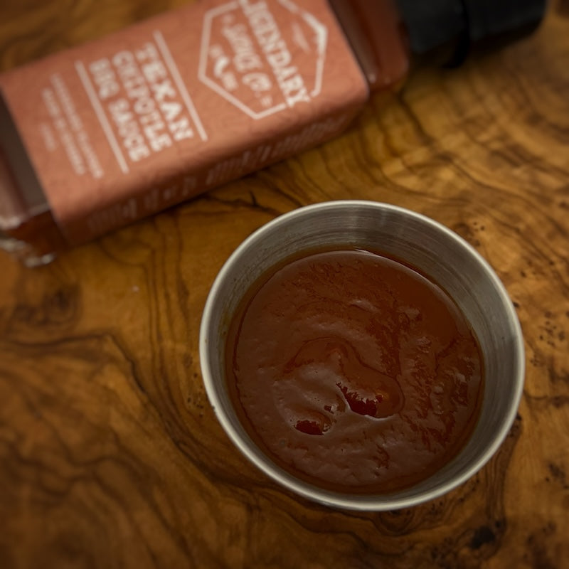 A small tub of hot sauce