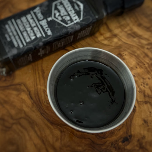 A small tub of hot sauce